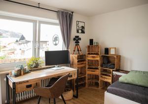 Sjónvarps- og/eða afþreyingartæki á Pura Vida Workation & Ferienwohnung