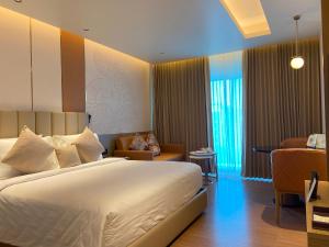 Llit o llits en una habitació de Grand Madurai by GRT Hotels