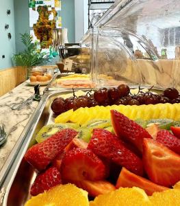 un vassoio di frutta su un tavolo a buffet di 19 Tile Ceramic Concept - by Unlock Hotels a Caldas da Rainha