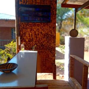 a room with a counter with a bowl on it at Sunshinevibe guest house in Kasane