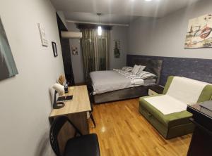 Кровать или кровати в номере Pg Apartment