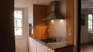 A kitchen or kitchenette at Appartement cosy avec cheminee a Eguisheim 110m² Terrasse