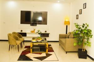 Televisor o centre d'entreteniment de Sunset Heights Resort & Residencia