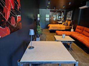 a living room with a couch and a table at Le 7 in Vieille-Toulouse