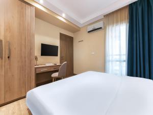 Ένα ή περισσότερα κρεβάτια σε δωμάτιο στο Second Home Hospitality, Rehab City, New Cairo