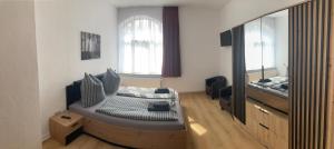 TV at/o entertainment center sa Eisenach - Apartments