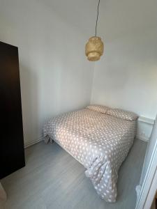 Llit o llits en una habitació de Apparement Cosy à Stains