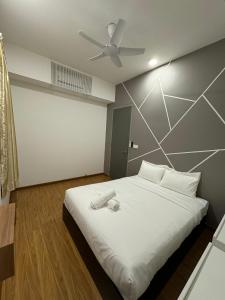 Tempat tidur dalam kamar di Cozy Comfort- Beacon Executives Suite