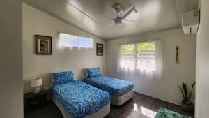 A bed or beds in a room at Aumaru Holiday Home