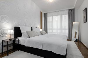 מיטה או מיטות בחדר ב-Highlife Apartment One Wiesbaden Wilhelmstraße