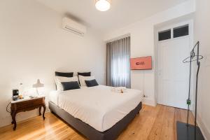 Tempat tidur dalam kamar di GuestReady - Zaza Guest House