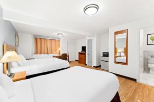 Krevet ili kreveti u jedinici u okviru objekta Americas Best Value Inn Stonington Mystic