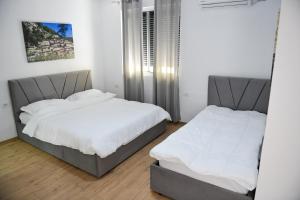 Postelja oz. postelje v sobi nastanitve Hotel Villa Edis