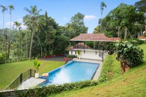 The swimming pool at or close to Theyila Wayanad Premium Pool Resort