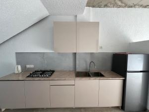 A kitchen or kitchenette at Cottages - Townhouses