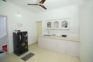 A kitchen or kitchenette at Lyba Home Stay