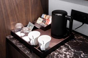 Fasilitas pembuat kopi dan teh di Luwian Athens Boutique Hotel