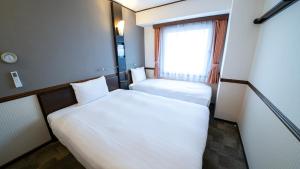 Toyoko Inn Shin-osaka Higashi-mikuni Ekimae 객실 침대