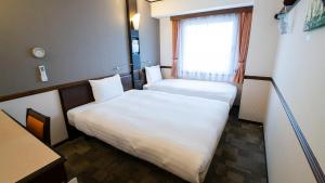 Krevet ili kreveti u jedinici u objektu Toyoko Inn Chubu International Airport No 2