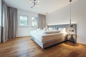 Giường trong phòng chung tại Ferienwelt Kesselgrub Hotel in Altenmarkt-Zauchensee