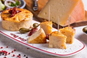 a plate with a bunch of food on a table at Pintxos in Malmedy