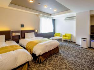 Krevet ili kreveti u jedinici u objektu Comfort Hotel Ise