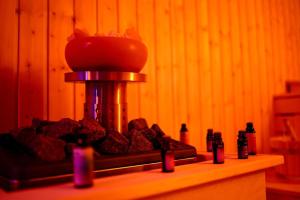 a counter with a pile of rocks in a room at Hanu lui Gica Spa in Satu Mare