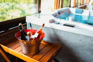 a bucket of beer and bottles on a table at Hanu lui Gica Spa in Satu Mare