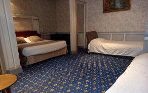 Cama ou camas em um quarto em Brit Hotel Comtes De Champagne - Troyes Centre Historique