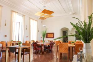 a dining room with tables and chairs and a ceiling at Alentejo Star Hotel - Sao Domingos - Mertola - Duna Parque Resorts & Hotels in Mina de São Domingos