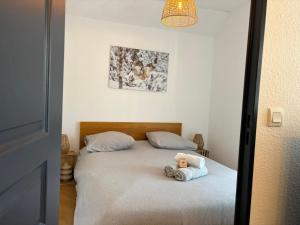 Llit o llits en una habitació de Appartement cosy rue Pasteur