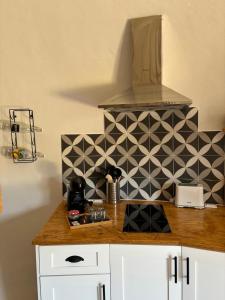 a kitchen with a counter top with a stove top at Casinhas dos Valados in Atouguia da Baleia