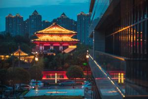 a chinese building in a city at night at Gran Melia Xi'an in Xi'an