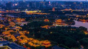 an aerial view of the city at night at Gran Melia Xi'an in Xi'an