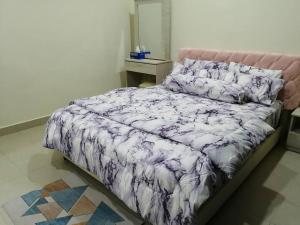 מיטה או מיטות בחדר ב-4-Bedroom Homestay in Taiping, Perak