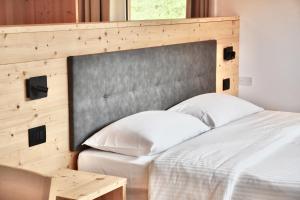 Una cama o camas en una habitación de Hotel Garni Civetta