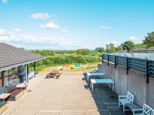 a group of benches sitting on top of a building at Holiday home Aabenraa LXXIX in Aabenraa