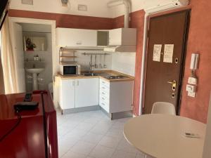 A kitchen or kitchenette at Gerenzano Apartments