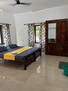 Una cama o camas en una habitación de Garden Villa Varkala