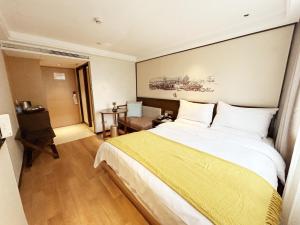 Krevet ili kreveti u jedinici u okviru objekta Guangzhou City Join Hotel Shipai Qiao metro Branch