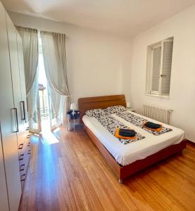 מיטה או מיטות בחדר ב-Trionfo your home in Trieste business and holiday stays