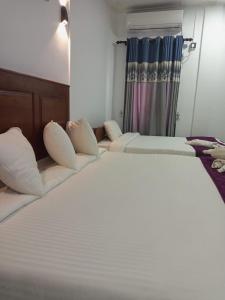 Cama ou camas em um quarto em Mannar Coccos Garden