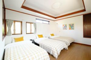 Krevet ili kreveti u jedinici u okviru objekta Villa Hiratsuka ツバメキタル-Vacation STAY