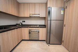 Kuchyňa alebo kuchynka v ubytovaní Manazel Aldiafah serviced Apartments AlSulymaniyah