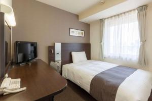 Кровать или кровати в номере Comfort Hotel Yokohama Kannai