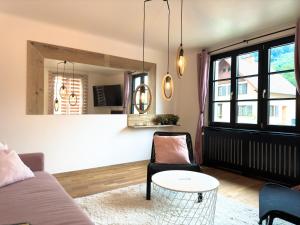 a living room with a couch and a table at Godi's House in Vianden