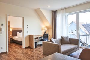 Das Landhotel am Trätzhof Fulda में एक कमरे में एक या कई बेड