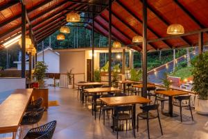 A restaurant or other place to eat at Theyila Wayanad Premium Pool Resort