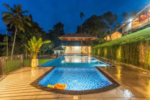 The swimming pool at or close to Theyila Wayanad Premium Pool Resort