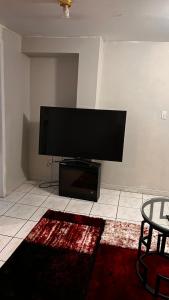 Cozy private room tesisinde bir televizyon ve/veya eğlence merkezi